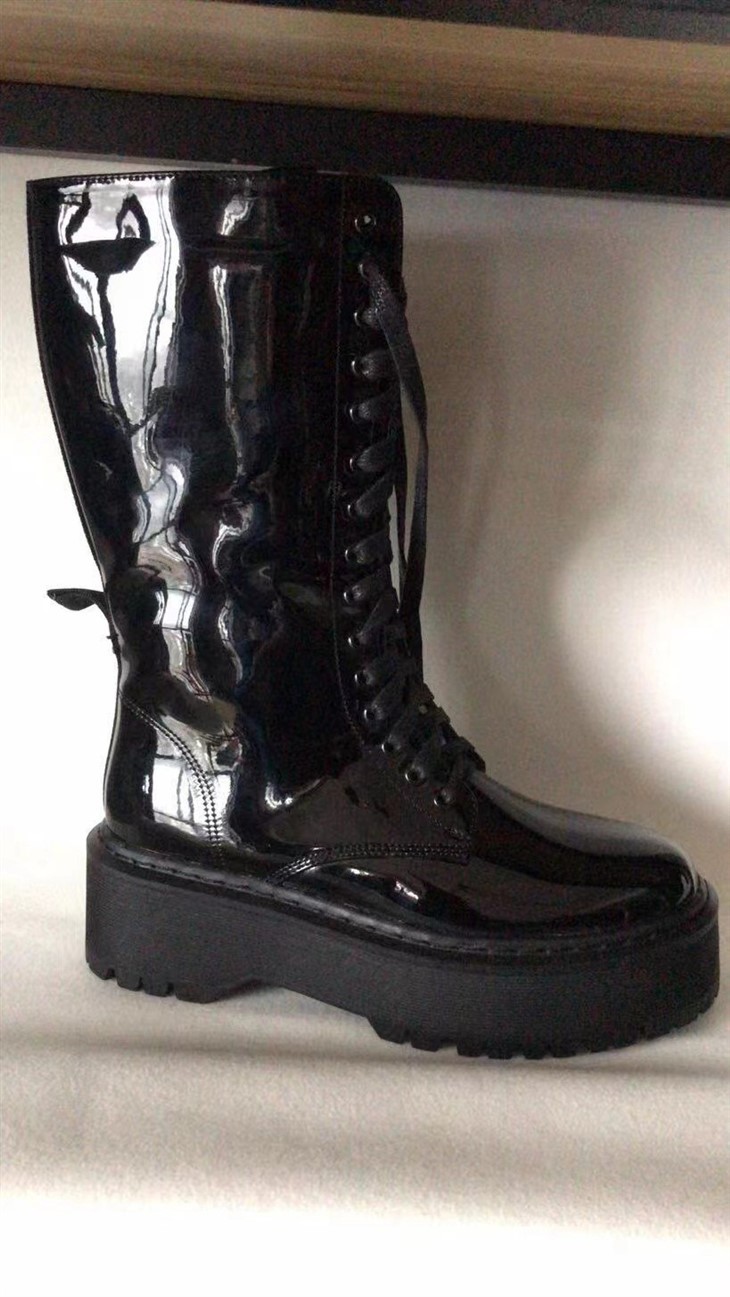 Bright black boots manufacture